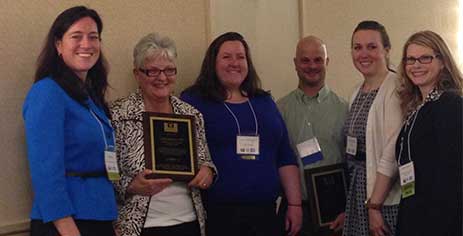 The 2015 Massachusetts Adult Immunization Champion awardees display their awards with Antonia Blinn and Robyn Alie.